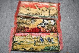 Three 20th Century machine made wall tapestries, of Eastern design, featuring camels and desert