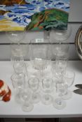 A collection of antique glasses, including etched and wine glasses and tumbler with etched logo; '