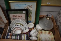 A Mintons cup and saucer in pinks and blues with floral banding, four Noritake cups and saucers with