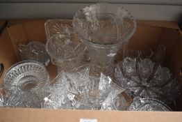 A large cut glass vase and similar smaller sold along with a selection of assorted glass fruit
