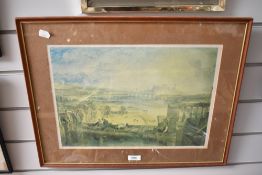A framed coloured print of Lancaster with the castle in the distance.