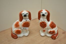 Two Staffordshire pottery dogs, approx 15cm high.
