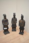 Three modern Chinese warrior figurines.