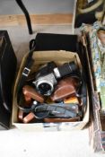 A collection of assorted cameras including a Minolta Autopak-8 S6 video camera with instructions and
