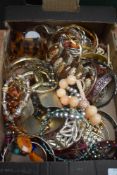 A large assortment of costume bracelets including bangles, statement cuff bracelets, beaded examples