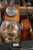 A Knights & Gibbins wooden mantel clock, an anniversary clock and a barometer.