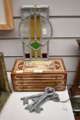 A pretty stained glass sun catcher, a vintage chest of drawers tin having art deco style