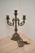 A Victorian brass three branch candelabra, measuring 40cm tall, sold with an ornamental brass