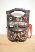 A 20th century African carved wood vessel, with lidded double compartment and geometrical carving of