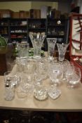 A collection of assorted cut glass and crystal items including four etched vases, four etched