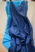 Three blue 1950s to 1960s maxi dresses and gowns.