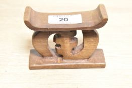 A miniture carved hardwood Ashanti stool.
