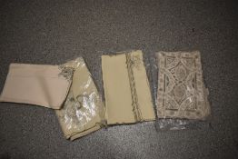 A collection of unused vintage Medeira work table linen.