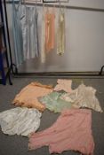 An assortment of vintage and antique lingerie, including slips, cami knickers and teddys, some af.