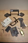 A box of metal door fittings and latches, to include a Victorian cast iron door handle with