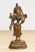 A 20th century cast and patinated metal figuire of the Hindu Goddess Tara or Mahavidya, and having