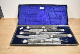 A cased carving set having antler handles.