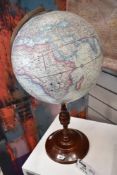 A modern reproduction globe and stand, of antique design measures 62cm.