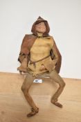 An unusual leather clad wire-work figure or puppet, depicting a young gentleman in hooded medieval