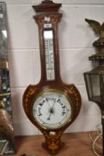 An Edwardian inlaid mahogany banjo barometer with urn and bellflower inlaid motifs.