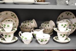 A Colclough china tea set decorated in an Ivy Leaf pattern and comprising teacups, saucers, cream