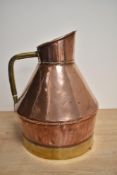 A Victorian copper and brass measure, of typical construction with rolled rim, angular handle and of