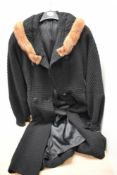 A vintage black wool coat, having mink collar and fit and flare skirt, a little wear in places,