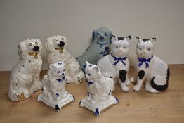 A pair of Royal Doulton bone china Staffordshire Pottery style spaniels with painted details and
