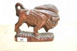 A 20th century carved bison study.