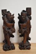 A pair of Chinese carved wooden immortals of traditional design with flowing robes 42cm (largest)