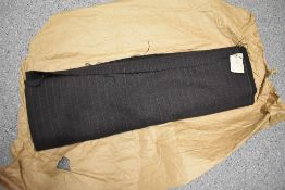 A bolt of vintage brown pin striped suit fabric. unused