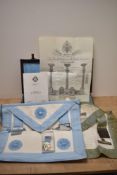 A leather suitcase of Masonic regalia, to include apron