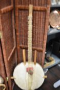 A West African Kora stringed musical instrument, measuring 130cm long