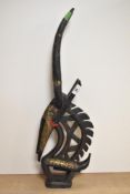 A 20th century African brass mounted and carved wood antelope, scratched mark to underside, 63cm