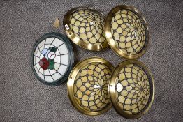 Four Tiffany style upturned lamp shade sold along with another Tiffany style lamp shade having