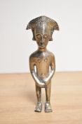 A North African cast metal statue of a male covering his genitals. 16cm high.