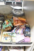 A selection of African items including four Kikoola bottle protectors, a vibrant dinner table set