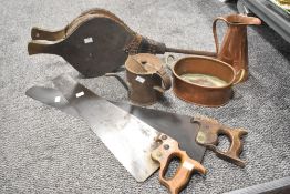 A pair of 19th/20th Century bellows, two vintage saws, and a small collection of copperware