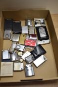 A collection of various cigarette lighters, Ronson, Kron, Zippo, and including two miniature