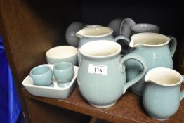 A small selection of Denby 'Manor Green' including cups, saucers, jugs and egg cups.