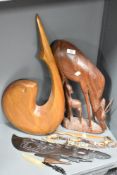 An African carved hardwood antelope and calf, measuring 45cm tall, another large carved wooden