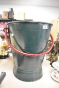 A large vintage iron bucket.