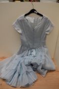 A powder blue 1950s day dress with tiered skirt to reverse.
