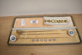 Two early 20th century hat pins and a set of matching buttons, in presentation box, having Mother Of