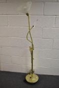 A modern crafters gooseneck standard lamp having integral magnifying glass and clamp.