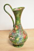 A decorative 'barge ware' hand decorated copper ewer, painted with badgers amongst profuse flowering