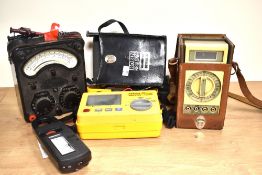 A mid-20th Century Universal Avometer, an Autoranging Insulation Tester, Beckman Multimeter, and a