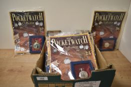 An assortment of The Pocket Watch Collection magazines each with a pocket watch, including '