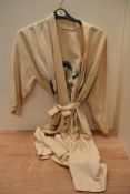 A vintage cream kimono with dragon embroidery.