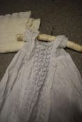 A vintage childs gown and bonnet, a Victorian christening dress and a shawl.